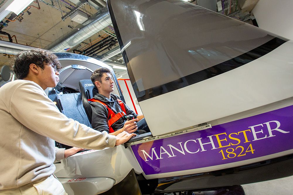 Two students using flight simulator