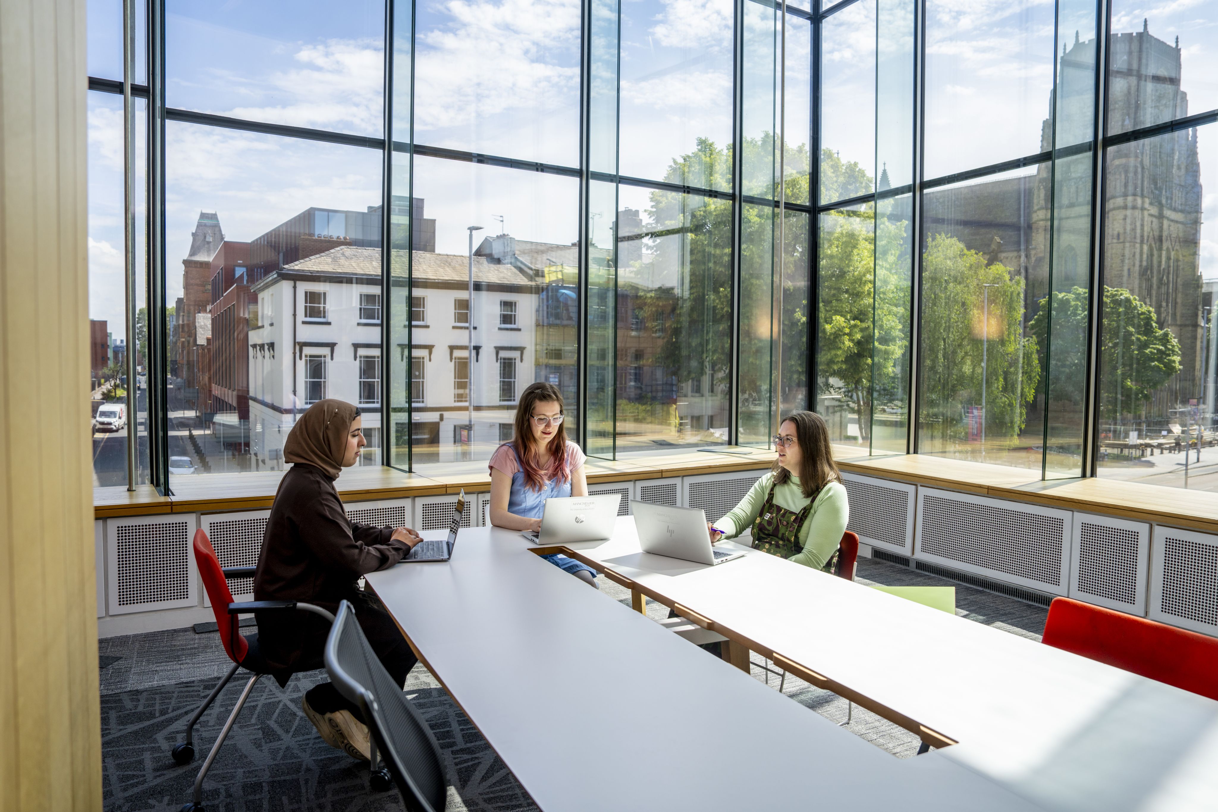 Students talking around table in AGLC