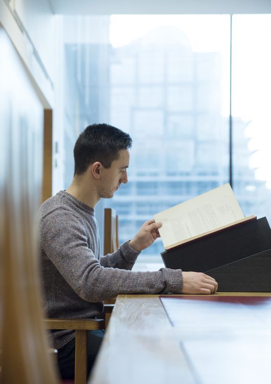 Researcher studying material in the John Rylands Research Institute and Library