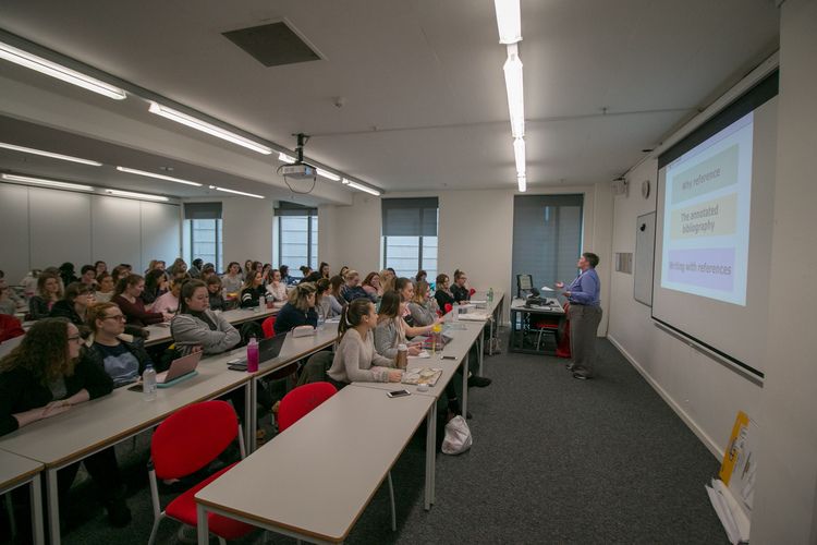 A staff member from Teaching, Learning and Students delivers a workshop to a room of students