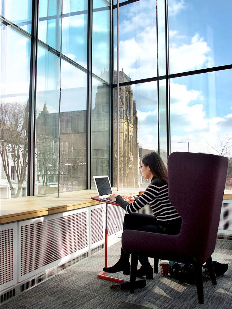 Student studying in window of AGLC