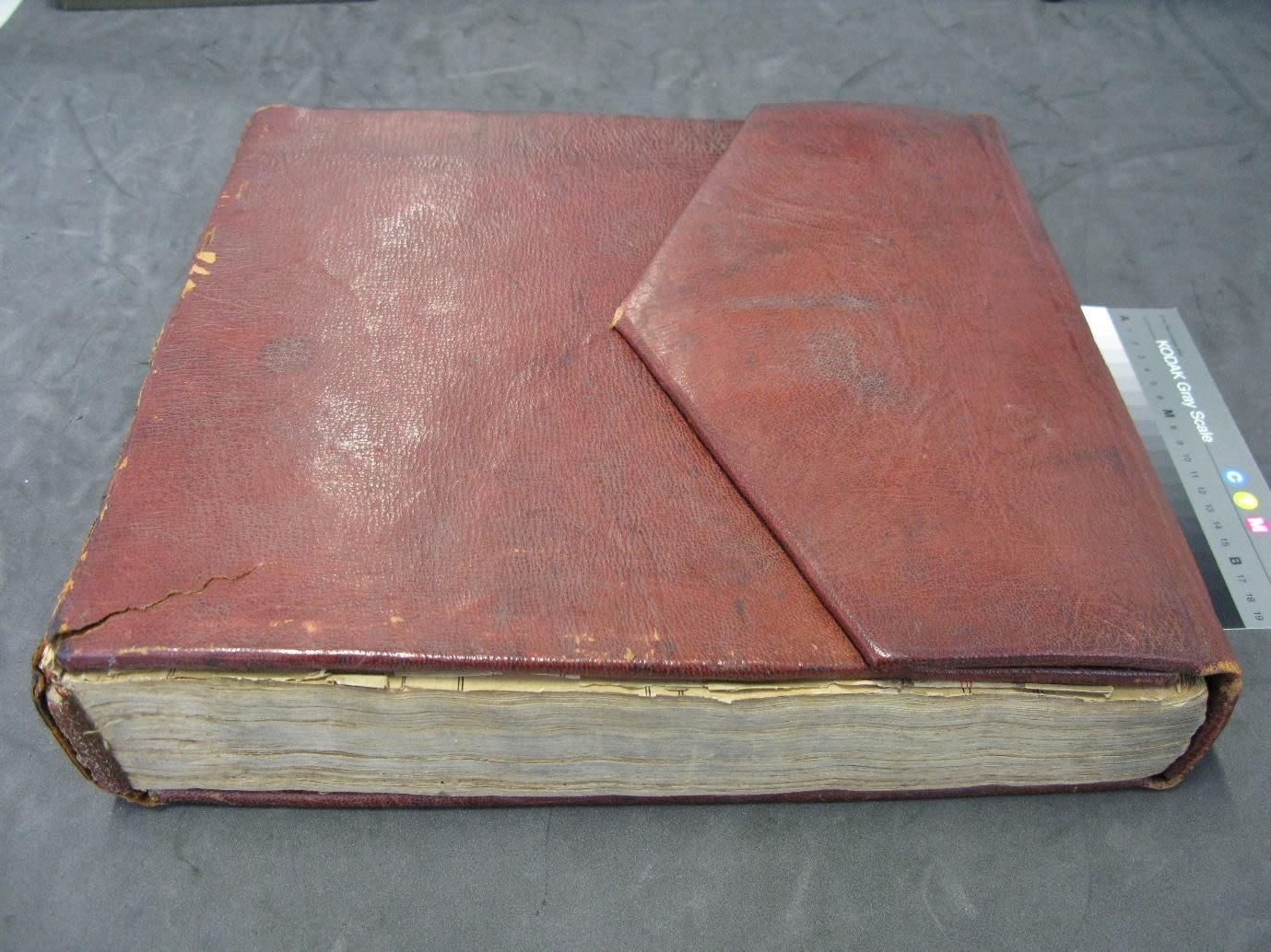 Punjabi MS 5. Guru Granth Sahib bound in dark red leather.