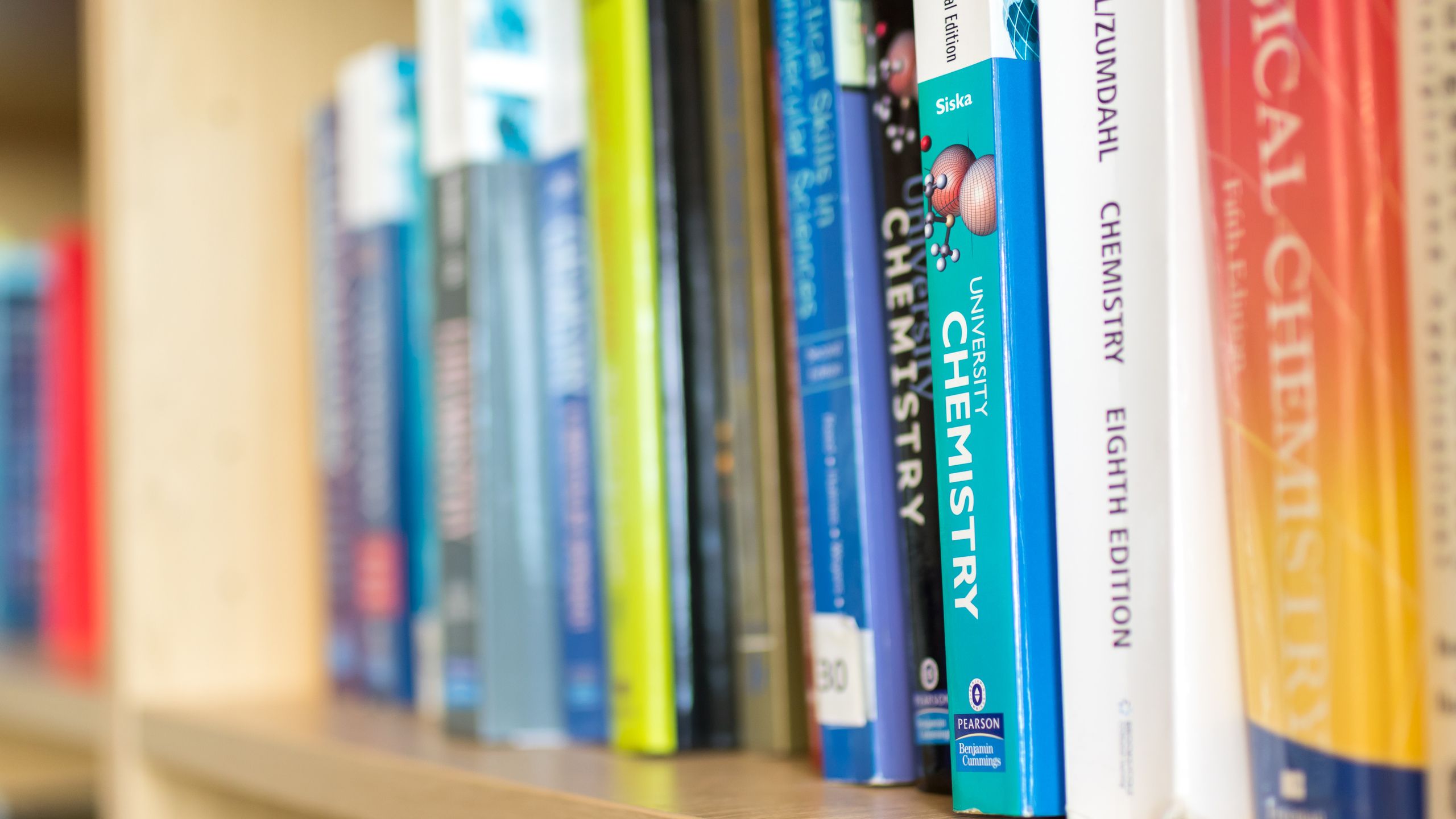 A row of books on a shelf in Stopford Library.