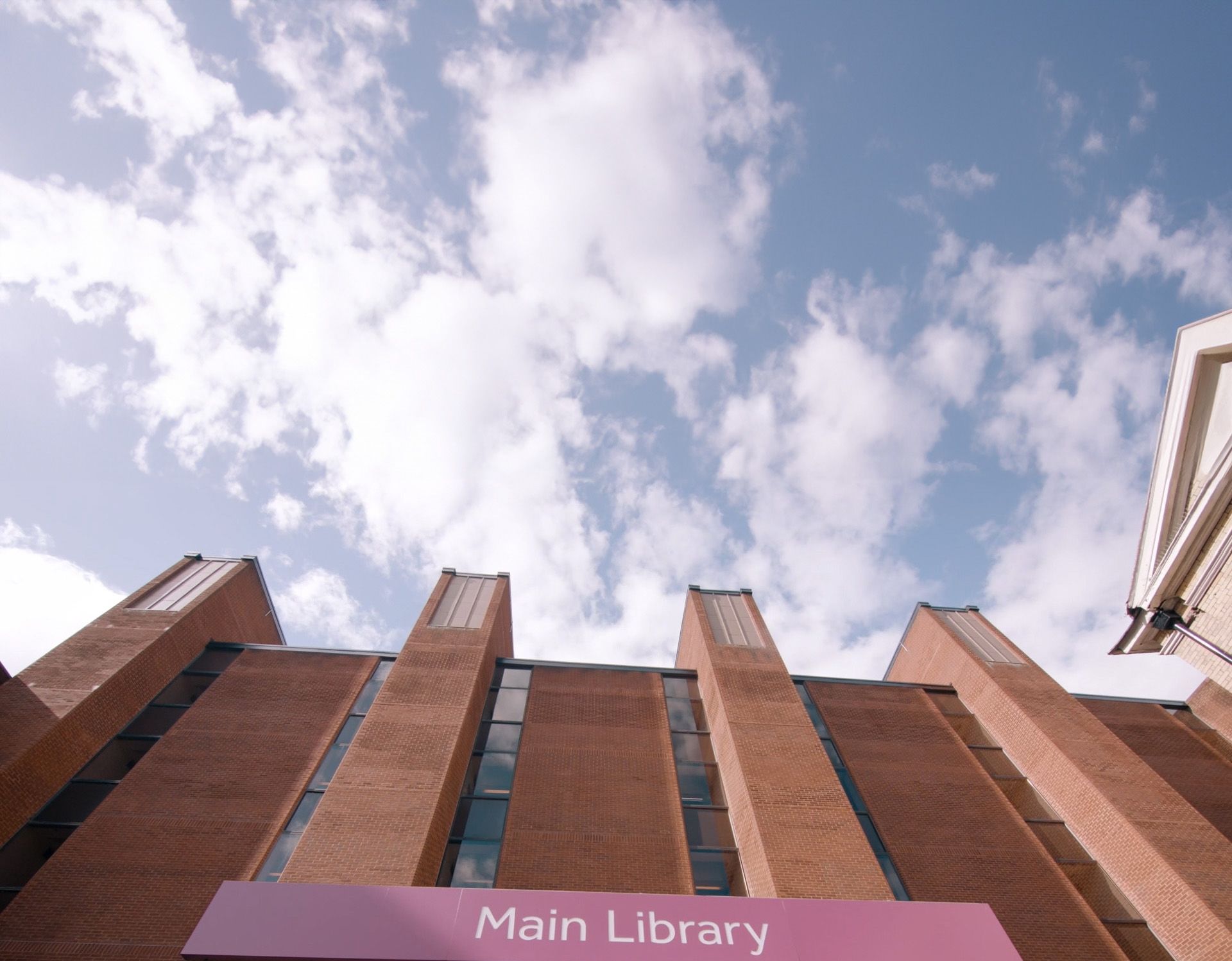 Blue sky above the entrance to Main Library