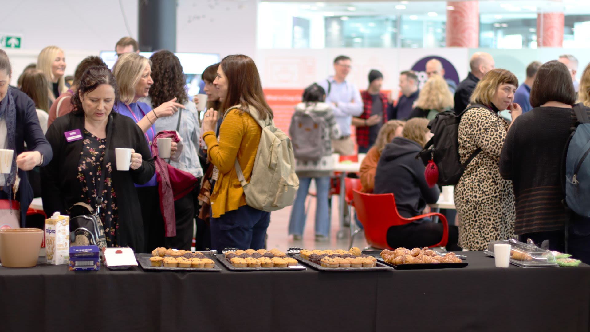 Attendees drinking tea and coffee at Together24