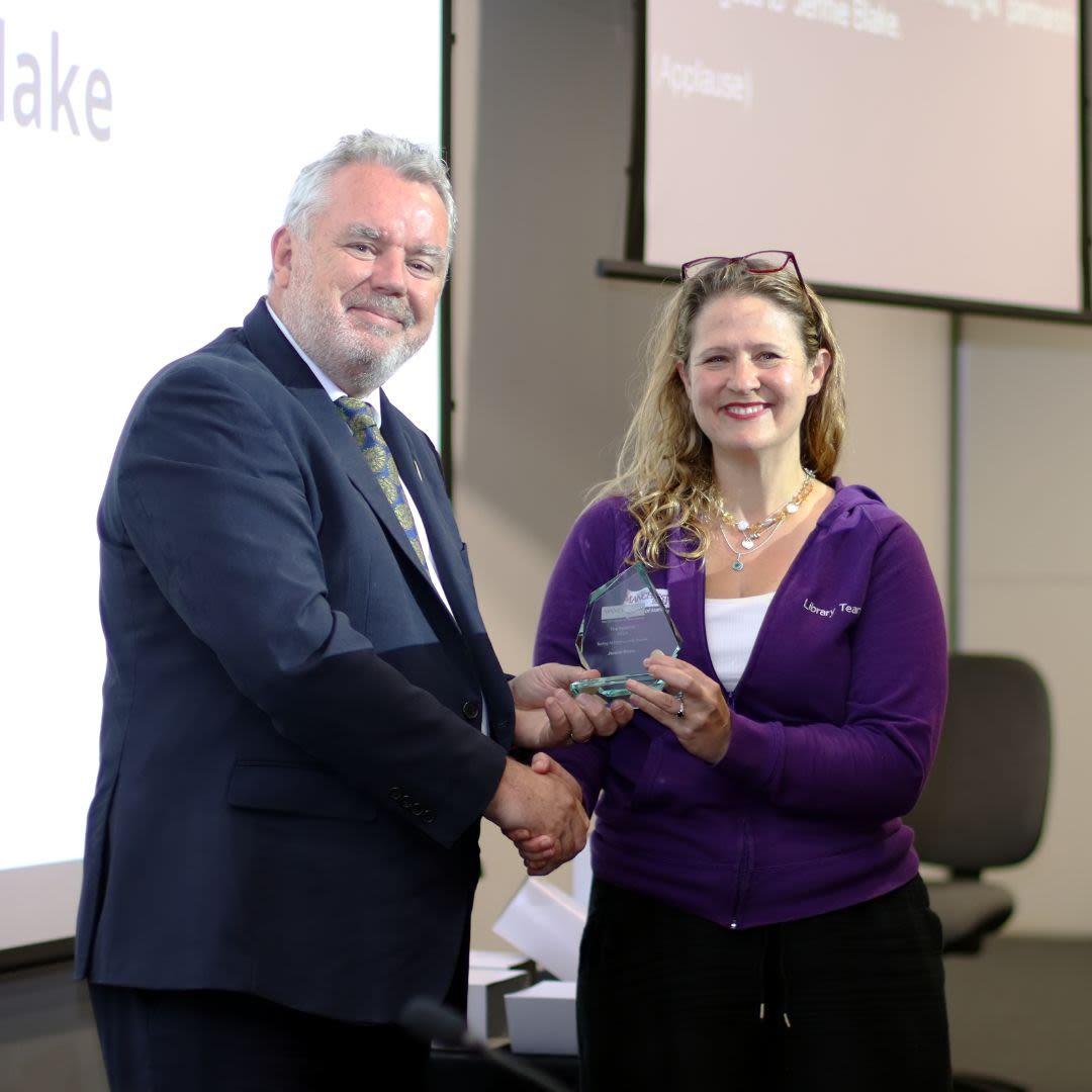 Patrick Hackett presenting an award to Jennie Blake at Together24