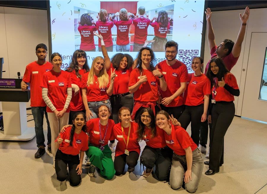 The Student Team posing happily in a group at the symposium