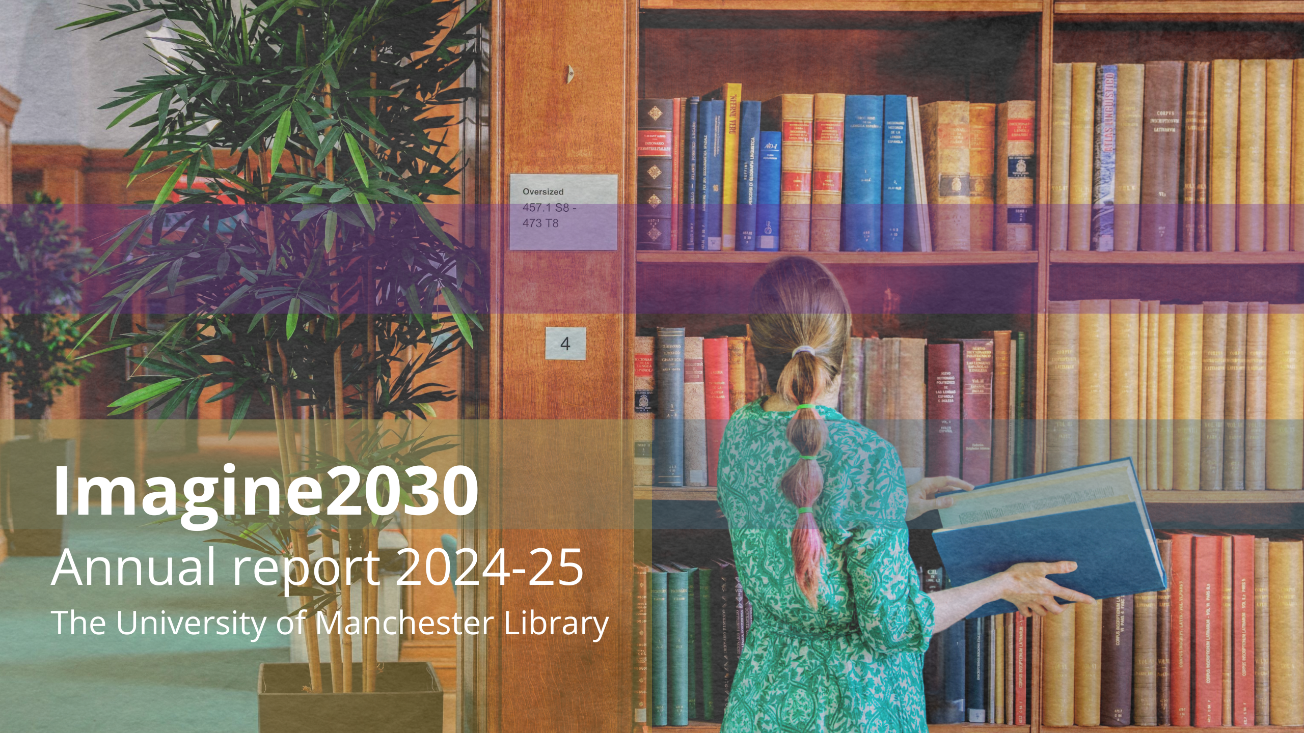 A woman looking at a book in a library standing by book shelves