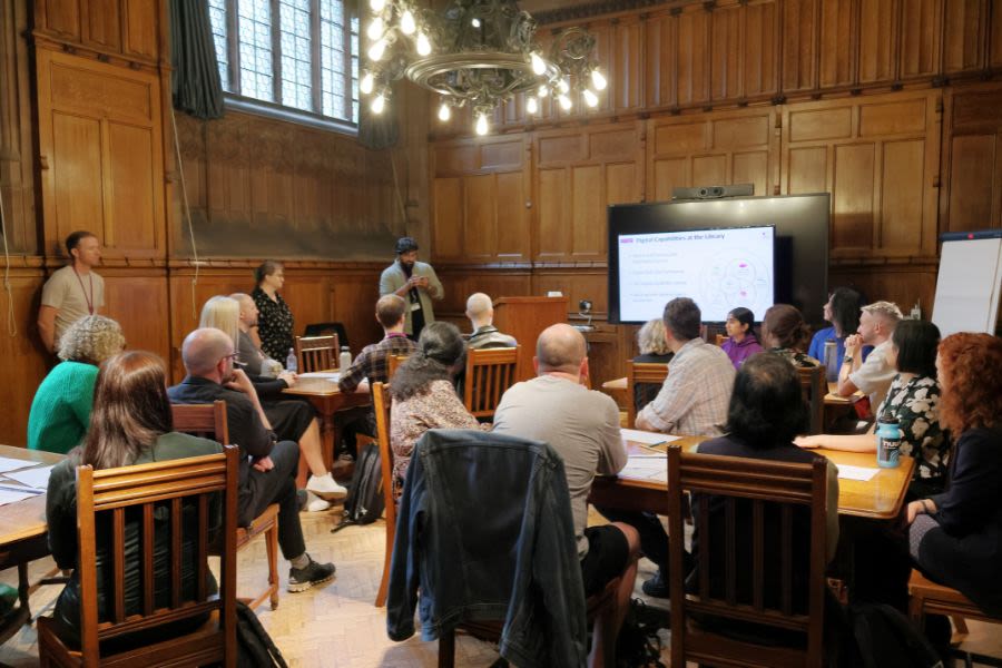 Staff sat in a breakout session in a room at John Rylands Library