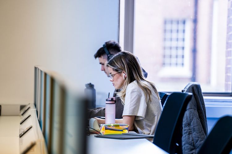 Two students sat at desks in Blue 1 recently redeveloped area