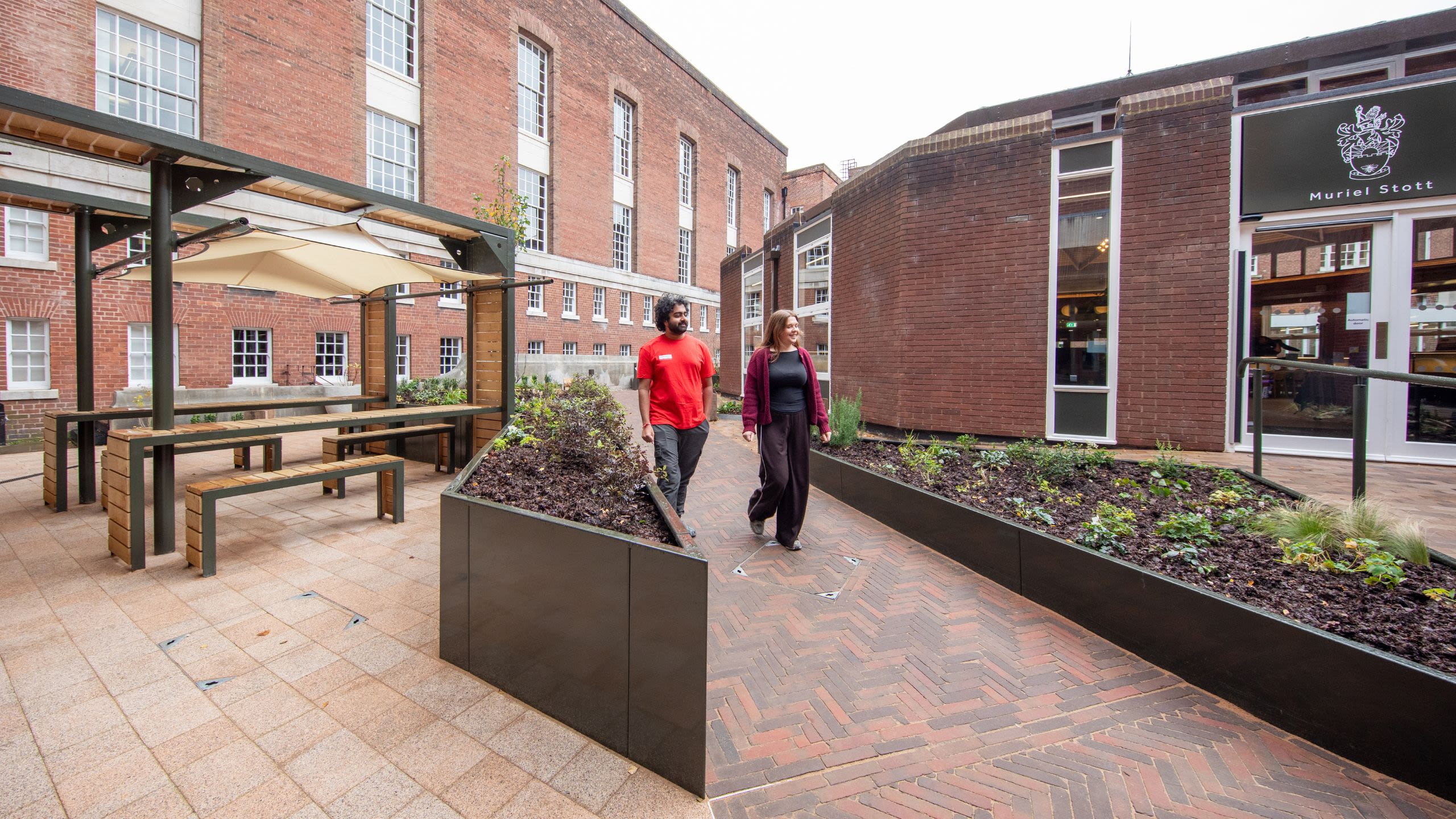 Students walking through the courtyard outside of Muriel Stott