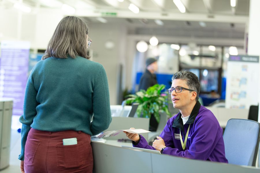 Member of Library Experience team speaking to a Library user