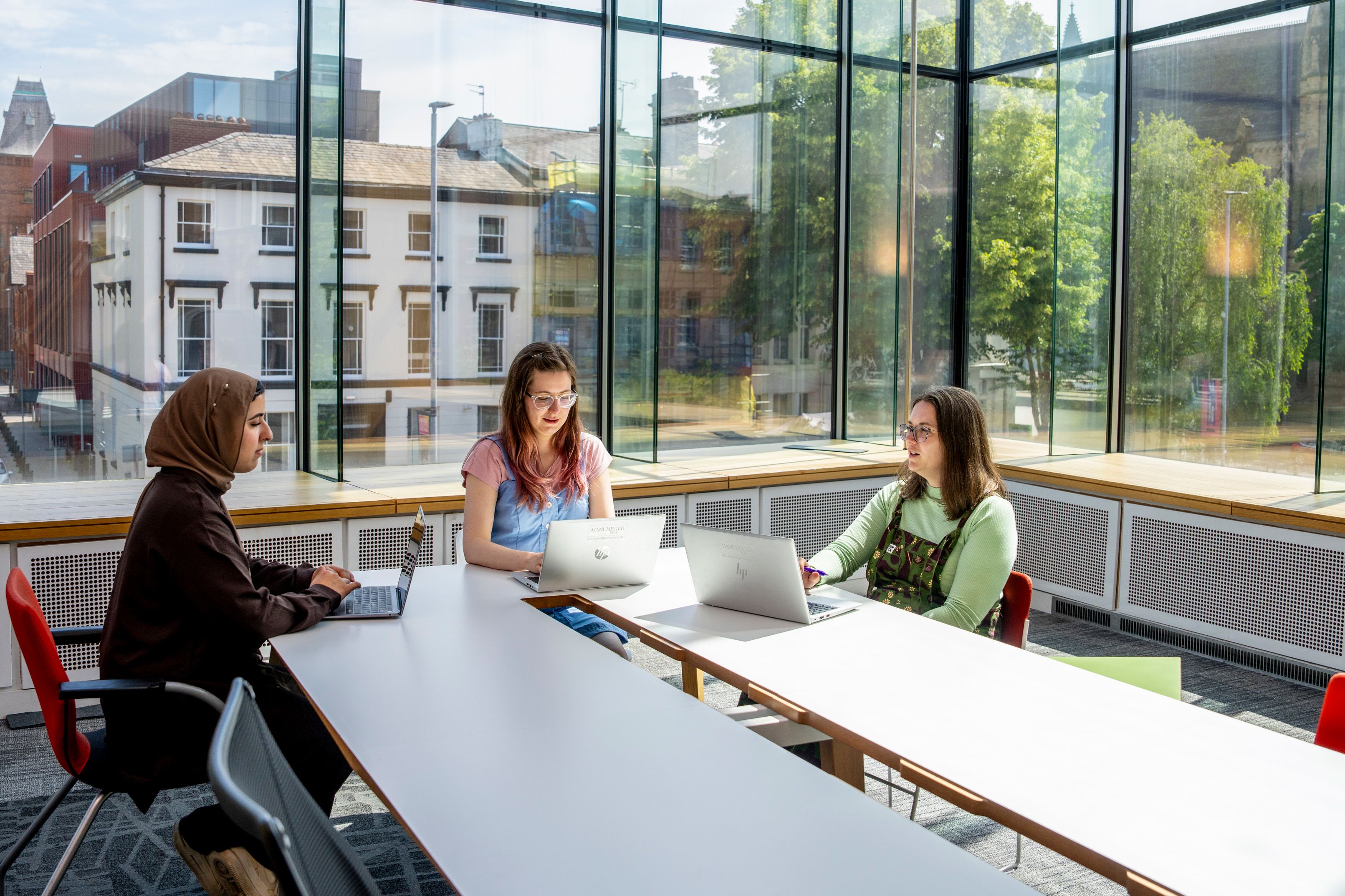 Students talking around table in AGLC